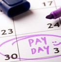 calendar having payday written on date with purple marker