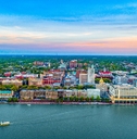 aerial shot of savannah with skylines and homes