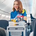 flight attendant serving food and drinks