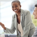 woman training a male employee in the office