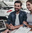 couple at car dealership