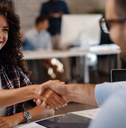 woman signing contracts and handshake with a manager