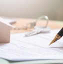 man signing documents with fountain pen
