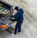 An adult man offering home services with a pickup truck