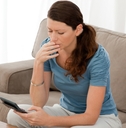 anxious woman calculating her debts