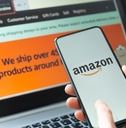 man using amazon online store app and website on laptop and smartphone