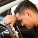 stressed young man in a car
