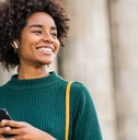 Smiling woman holding phone