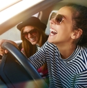 Two women in a car laughing