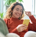 Woman playing on mobile phone