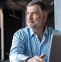 mature businessman working on laptop