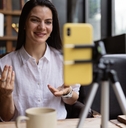 Woman filming herself with a phone