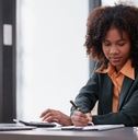 woman working on laptop and doing taxes
