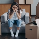 unhappy woman is sad because of relocation
