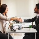 woman shakes hands with a businessman