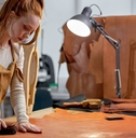 hardworking artisan concentrated on keeping leather in good shape