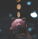 Money going into a piggy bank