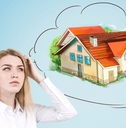woman standing in formal shirt scratching her head while thinking about new home 