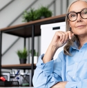 senior businesswoman looks seriously at the camera