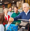 customer paying at the supermarket cashier 