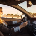 beautiful business woman driving car
