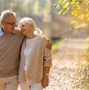 happy senior couple in autumn park