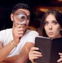 couple surprised by the  expensive restaurant bill