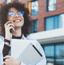 Smiling woman talking on phone