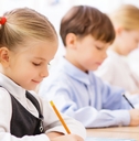 pupils are writing in their copybooks