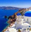 white buildings with blue domes in oia town santorini island