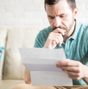 Latin man reading correspondence