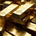 stacked of gold bars piling up