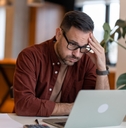 businessman in the home office feeling frustrated 