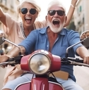 Retired happy senior couple enjoying holidays while riding scooter on the roads of Italy, Europe.