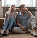 elder couple of homeowners exhausted with relocation