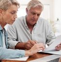 senior couple reviewing bills at home