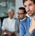 Isolated businessman lost in thoughts