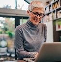 Mature businesswoman working on laptop