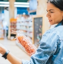 woman shopping for snacks at store