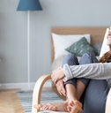 Woman relaxing in cozy chair