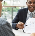 A financial advisor is offering advice to a couple