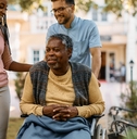 Woman visiting her elderly father at the nursing home