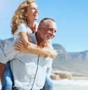 mature couple enjoying beach vacation