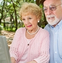 senior couple on laptop