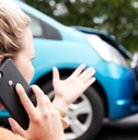woman on phone after car accident