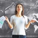 woman besides board with finance charts