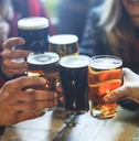 friends drinking and toasting beer