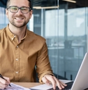 young businessman smiling at office