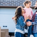 happy family outside new house