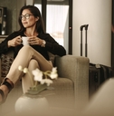businesswoman having coffee at airport lounge
